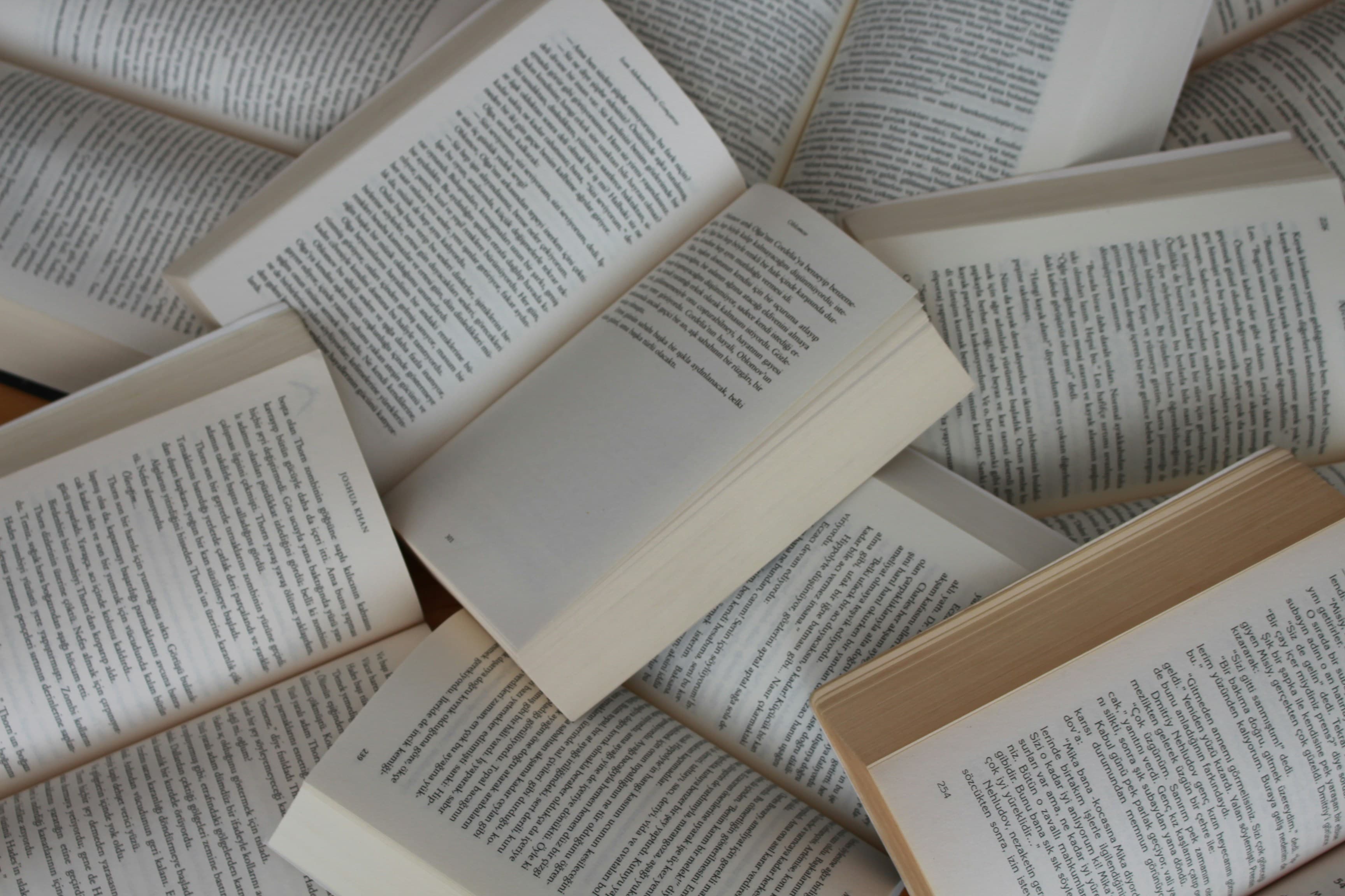 Open books arranged on a table