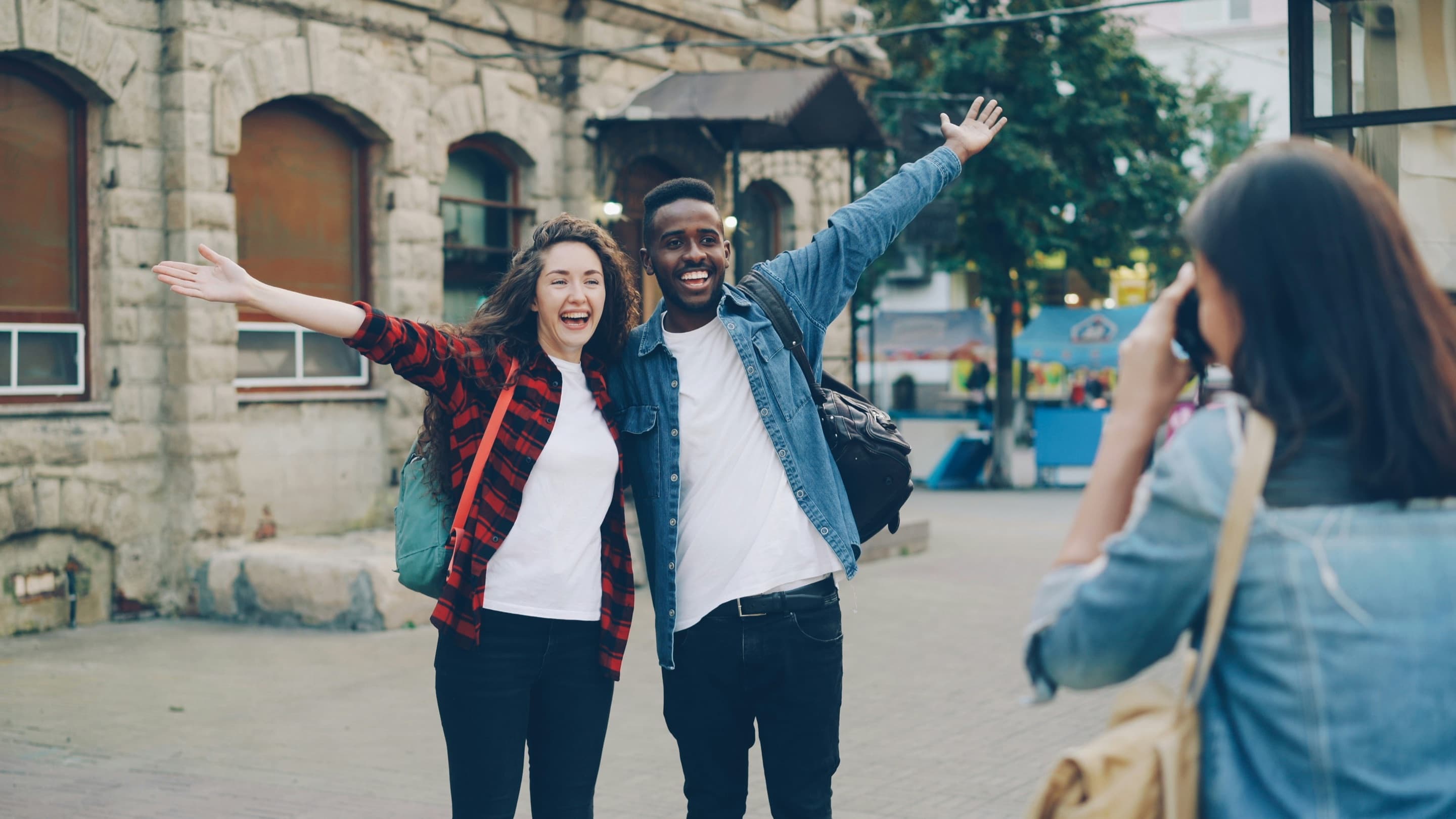 Students celebrating together outside a university